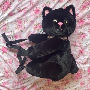 Sugar Thrillz hugging cat backpack